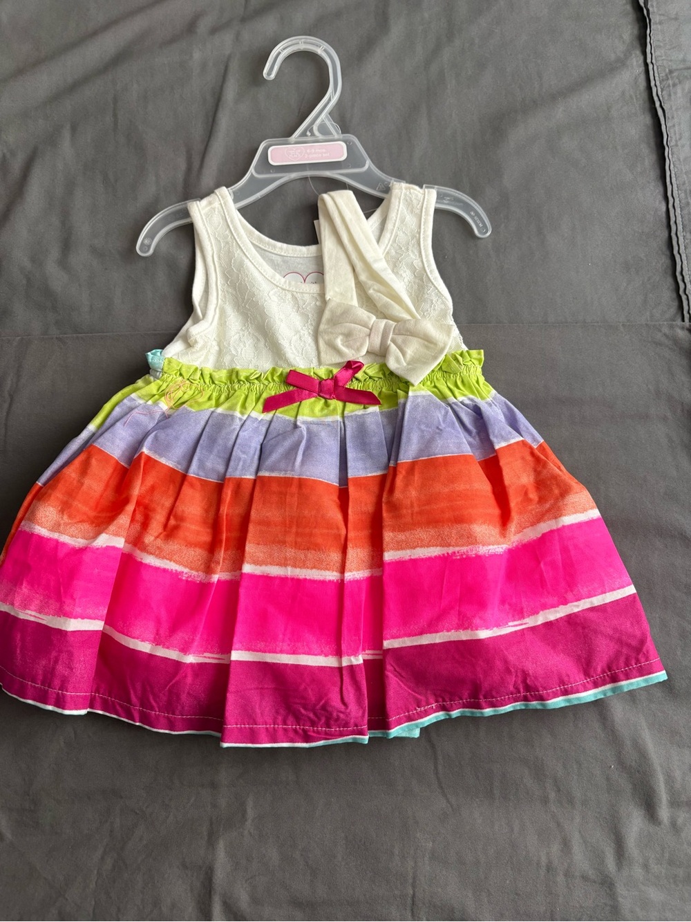 Sleeveless Cream Top Dress with Bright Multicolor Striped Skirt